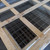 Open-top wood crate of stacked Curbs Plus CPC-3 roof curbs showing their welded wire safety screens