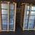 Two wood-crated stacks of Curbs Plus CPC-3 galvanized roof curbs in a warehouse, ready to ship