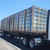 Curbs Plus roof curbs crated in wood A-frame stands loaded on a flatbed trailer for shipping