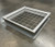 Curbs Plus CPC-4 roof curb with 4-inch-on-center safety screen, photographed on a warehouse floor