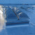 Close-up of a Taylon 4896 ULVSV smoke vent on a white membrane roof showing its faceted dome lids