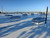 Wide rooftop view of several Taylon 4896 ULVSV smoke vents with transmission towers and a city skyline behind them