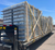 CPM-3 roof curb panels stacked and wood-braced on a flatbed gooseneck trailer for shipment