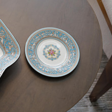 This vintage bread and butter plate features a vibrant design that combines intricate patterns and bold colors.  This is a classic and timeless vintage treasure.