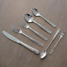 This rare vintage Oneida flatware set, pattern OHS93, offers five complete place settings of premium Japanese 18-8 stainless steel, combining mid-century craftsmanship with elegant design sensibilities from the early 1960s.