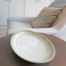 This vintage Fabergé oval serving platter in the Luxembourg Green pattern is the pinnacle of sophistication. Measuring an impressive 16" long, this rare piece of fine Limoges china exudes luxury, refinement, and timeless elegance.