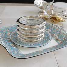 Stacked set of three vintage silver rimmed glass coasters