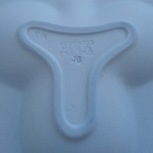 The back of a Wedgwood Jasperware ring dish, showing the Wedgwood imprinted makers stamp.