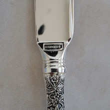 Vintage cake knife by Godinger .  Made with ornate silverplated handles in a floral theme.