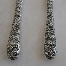 Vintage cake serving set with cake knife and cake server by Godinger .  Both serving utensils are made with stainless steel blades and ornate silver plated handles.  These would be a excellent addition to your wedding decor.