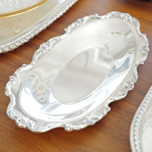 Silverplated vintage trinket dish with embossed roses on the edges made by Wallace in model 9807