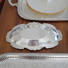 Designed for both function and beauty, this Wallace Royal Rose silver-plated tray is a stunning mid-century serving piece. The intricate floral detailing adds charm, making it perfect for formal dining or vintage decor.