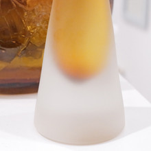 Minimalist and sophisticated, this handmade glass form doubles beautifully as a bud vase.