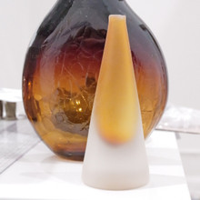 Frosted and smooth to the touch, this art glass vessel can be used to display a single stem flower.