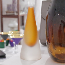 A handmade glass scent bottle with a modern gradient design, equally striking as a vase or art piece.