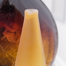 Mouth-blown with precision, the bottle’s amber hue glows beautifully in natural light.