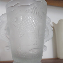 The whimsical fish design and elegant proportions make this vase equally perfect for displaying a single bloom or standing alone as sculpture.