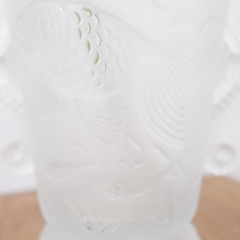 A delightful example of Barolac glass from the 1930s, this vase showcases dimensional fish swimming through bubbles and seaweed in beautiful pressed glass.