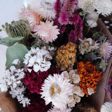 Dried flower bouquet mix of saturated magenta pinks, subtle pink and purple hues, marigold orange, deep yellows, and natural whites.  All natural flowers without the use of dies.