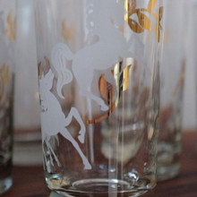 White unicorns prance among metallic gold leaves in this charming 1950s Libbey glass design from 1952.