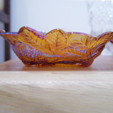 The raised leaves and berry clusters give this bowl a beautiful textured design.