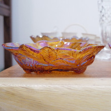 This Indiana Glass Loganberry bowl glows in amber carnival glass with raised leaves and berries.