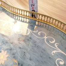 Elegant and functional, this Italian tray makes a perfect serving piece or display accent with its brass trim and glass-protected floral design.