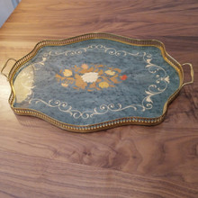 With its pierced brass gallery and marquetry floral motif, this tray brings sophistication to bar carts, vanities, or coffee tables.