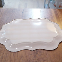 Sturdy metal construction meets delicate hand-painted artistry in this collectible tray.