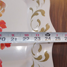 Oversized and ornate, this metal tray is equally beautiful on a bar cart, vanity, or hung as wall art.