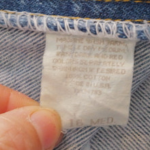 Durable 100% cotton denim with a medium wash and timeless style.