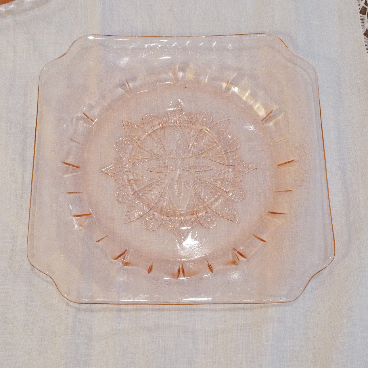 Vintage Jeannette Glass Co Adam pattern plate in pink Depression glass. Produced between 1932 and 1934 during the Great Depression era.