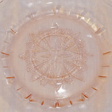 Features a floral and geometric medallion design in the center.  The Adam pattern is one of Jeannette’s most beloved glass designs.