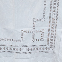 Features cut lacework with geometric and floral motifs.  Bright white color complements both rustic and modern tables.