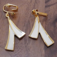 These dangle earrings are an accessory for 1980s-inspired fashion styling.  Adds a bold retro statement to any outfit.