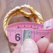 Minimalist yet sophisticated Trifari bangle in gold tone.