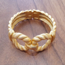 Trifari’s iconic craftsmanship shows in this hinged bracelet.