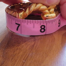 Trifari gold-tone bangle, secure and easy to wear every day.