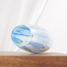 Cool blues and greens melt together across the vase in a loose, watercolor style. Its height and gentle tapering shape create a graceful overall look.