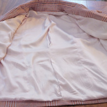 The wool jacket is lined in 100% silk for comfort and elegance.  A luxury statement wardrobe piece.