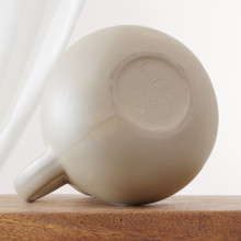 Made of durable stoneware with a soft matte surface, this Hartstone pitcher reflects timeless modern craftsmanship. It’s equally suited to serve water or to stand as a display piece.