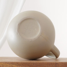 Matte finished stoneware water pitcher with glazed interior.  Created by Hartstone pottery in the US.