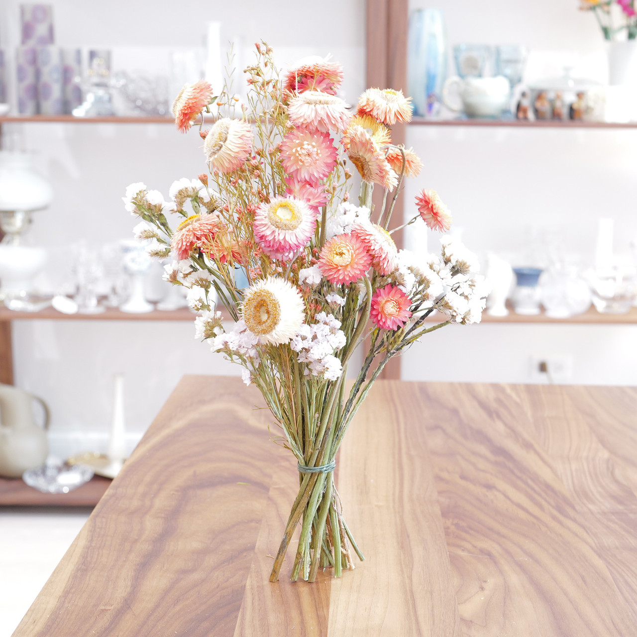 Hand-tied flower bouquets, slowly dried in our Avondale boutique.  Bouquets are a mix of pinks, creamy greens, soft yellows, spots of burgundy, highlights of magenta, and punchy whites.
