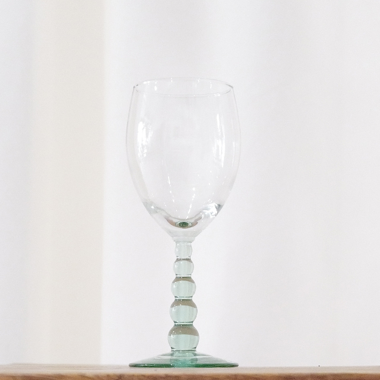This vintage water glass is the Metropolis Spanish Green pattern made by Libbey Glass Company around 2008.