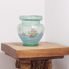 The name of the Santa Maria along with the date 1942 appear on the sail of the main ship.  The two smaller ships, La Nina and La Pinta, have identifying markings.