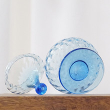 Vintage optic blue glass jar is an exceptional example of mid century collectible glass from Empoli, Italy.