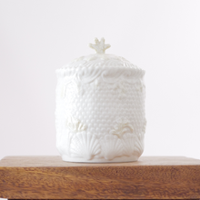 This Belleek biscuit jar was produced in Ireland between 1980 and 1993 and features the intricate New Shell pattern.  Made from Belleek’s creamy Parian porcelain, the jar showcases fine shell and coral reliefs, scalloped edges, and a coral-branch finial lid.
