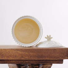 The embossed design on this lidded jar is coral and shells.  Even the lidded jar features a finial is shaped like a small branching piece of coral.