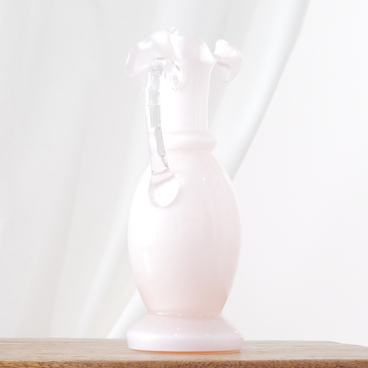 Fenton rose pitcher for Weil Glass.  Soft pink opaline collectible.  Classic ruffled Fenton top.
