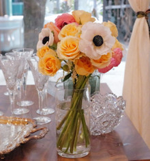 Send a bouquet of soft peaches, blushes of pink, and creamy white flowers fill this fluffy and soft bouquet of high-end stems.